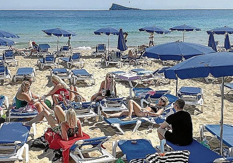 A group of sunbathers at Levante beach.