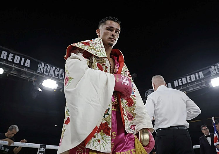 Molina wearing a cape gifted by bullfighter Saúl Jiménez Fortes.