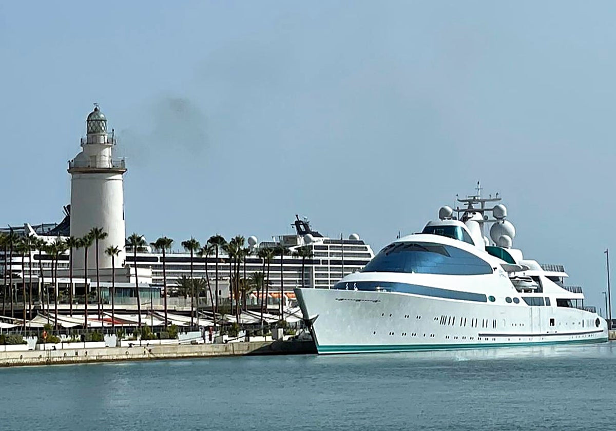 The Yas moored next to lighthouse at Malaga's megayacht marina.