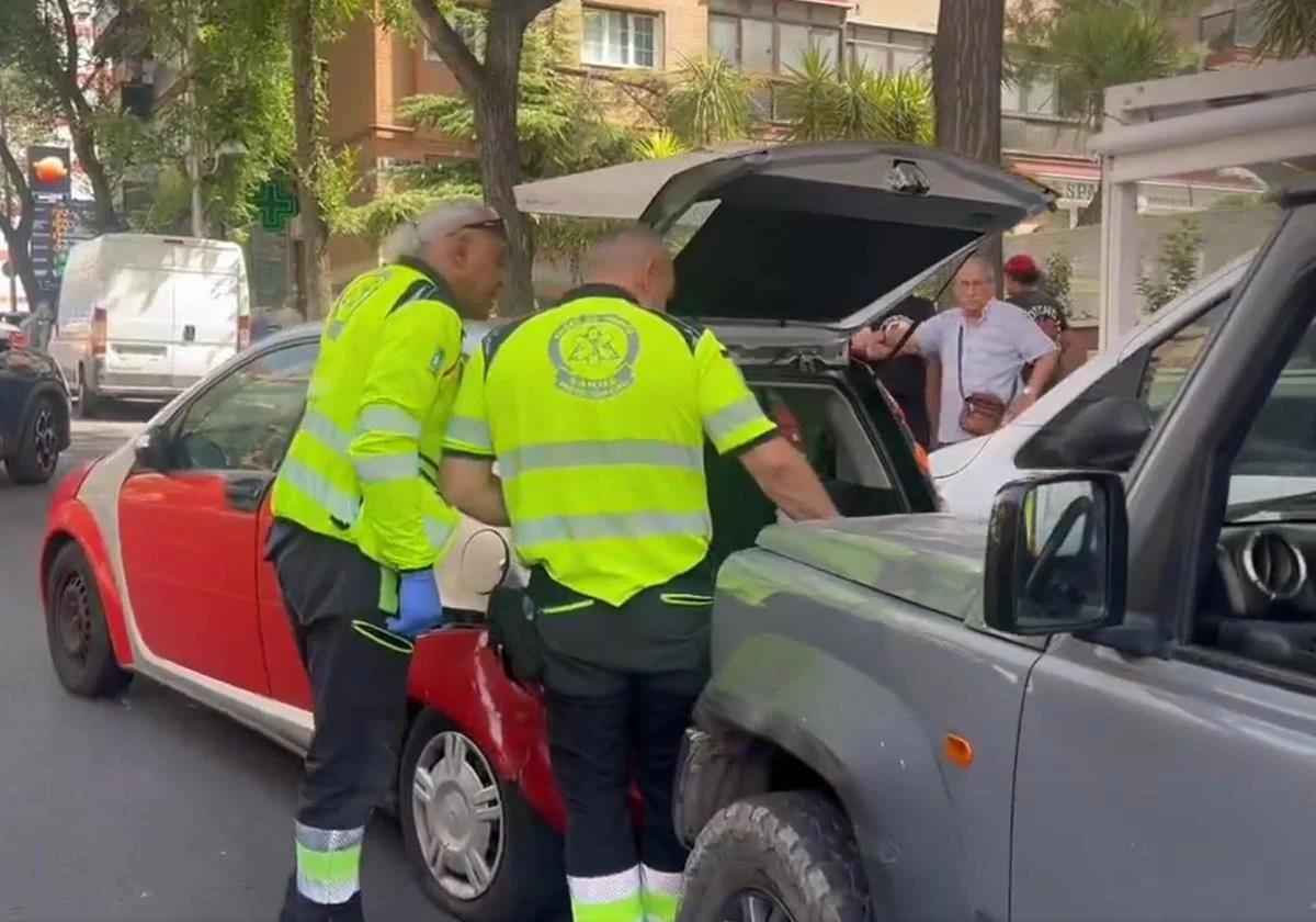 Two healthcare workers at the scene of the fatal incident.