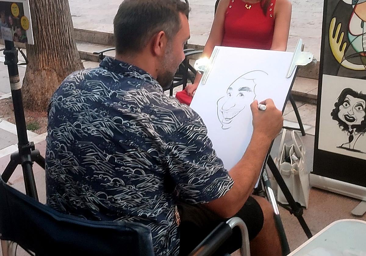 Image of one of the Marbella caricaturists and his work.