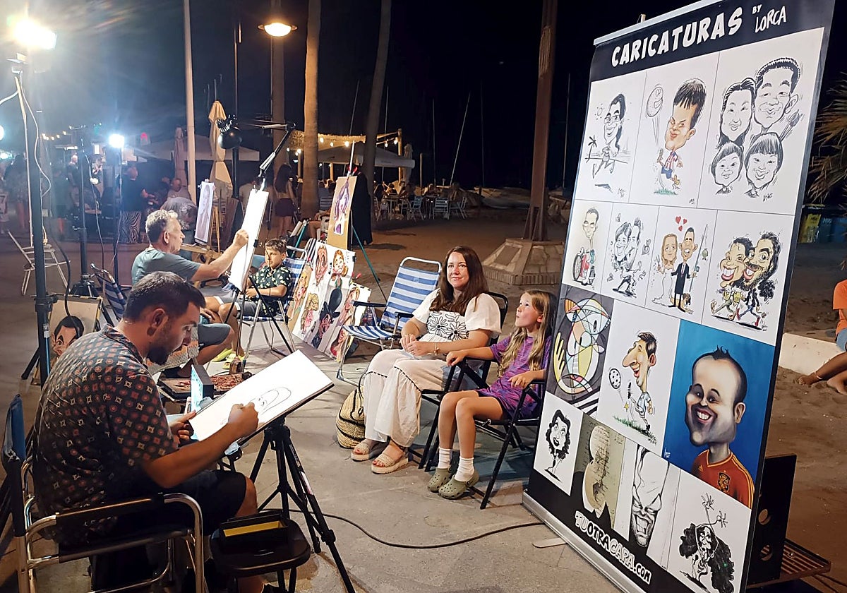 Daniel Segarra, in the foreground, with José Ramón Sosa, working this summer in La Cala de Mijas.
