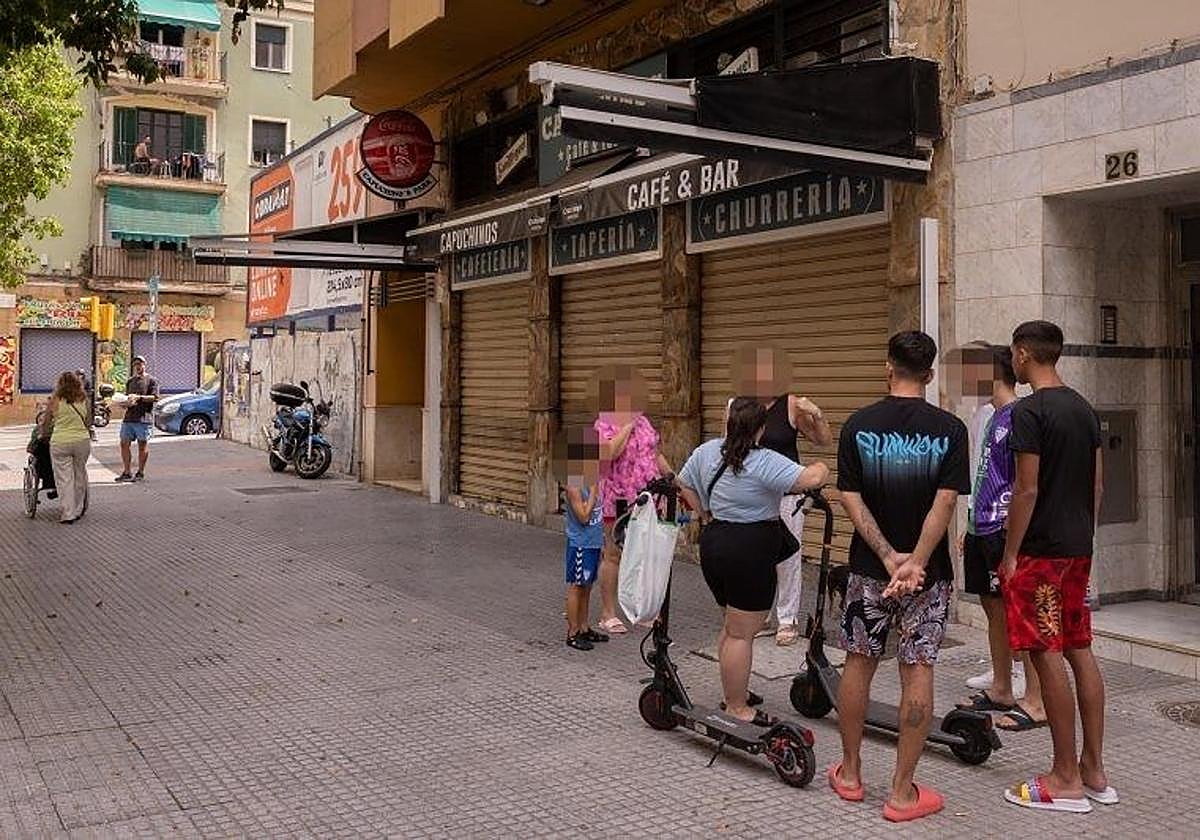 Local residents at the scene of the stabbing this Sunday.