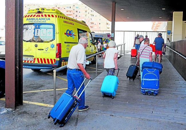 Portuguese holidaymakers arriving at the hotel amidst ambulances.