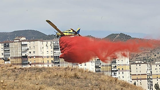 Planes and helicopter join firefighting efforts as wildfire in Malaga city is declared 'stabilised'