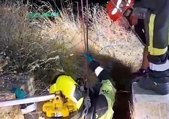 Firefighters at the well where David Ruiz's body was found.