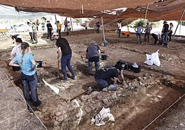 Archaeologists and volunteers work at Cerro del Villar, one of the best preserved sites.
