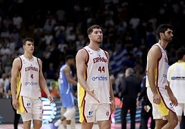 The Spain players after losing to Greece.