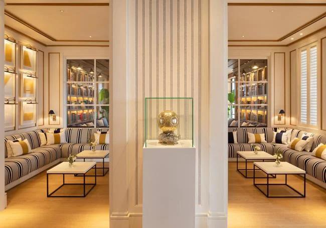 One of the footballer's Ballon d'Ors is displayed in the hotel lobby.