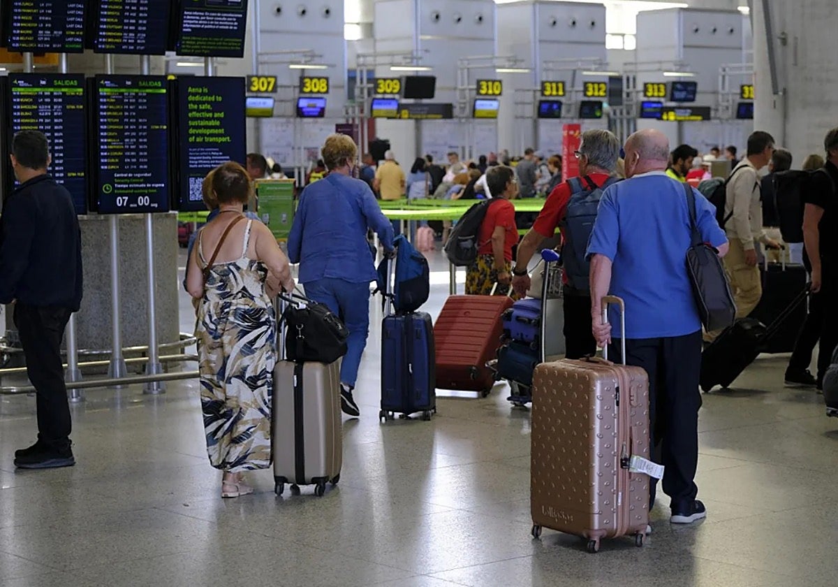 When is the best time to travel to find the cheapest flights at Malaga Airport?