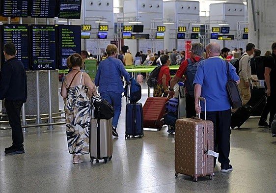 When is the best time to travel to find the cheapest flights at Malaga Airport?
