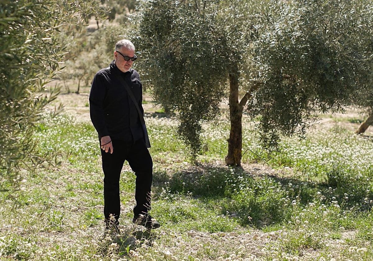 Spencer Tunick in the olive grove chosen for the art installation.