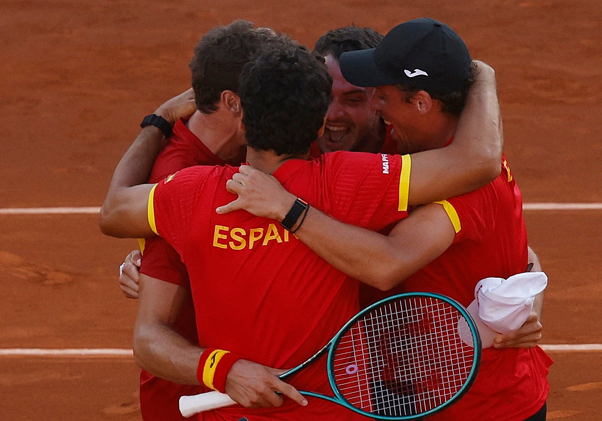 The Spain players celebrate Sunday's comeback against Denmark.