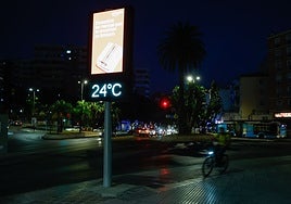 Street thermometer in Malaga city displaying 24C in the middle of the night.