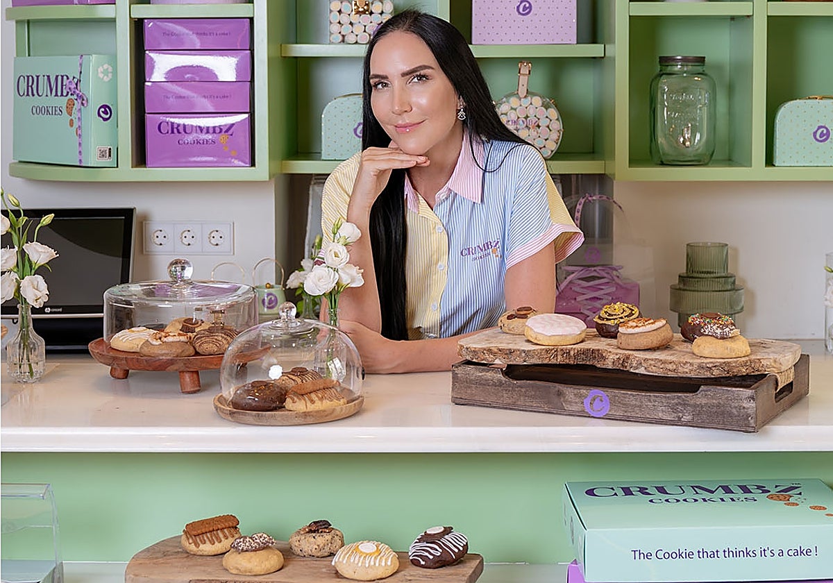 Debbie Wingham, considered one of the top ten cake creators, poses with some of her creations.