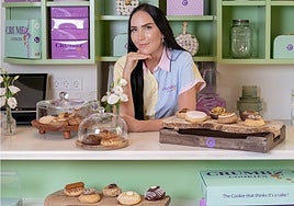 Debbie Wingham, considered one of the top ten cake creators, poses with some of her creations.