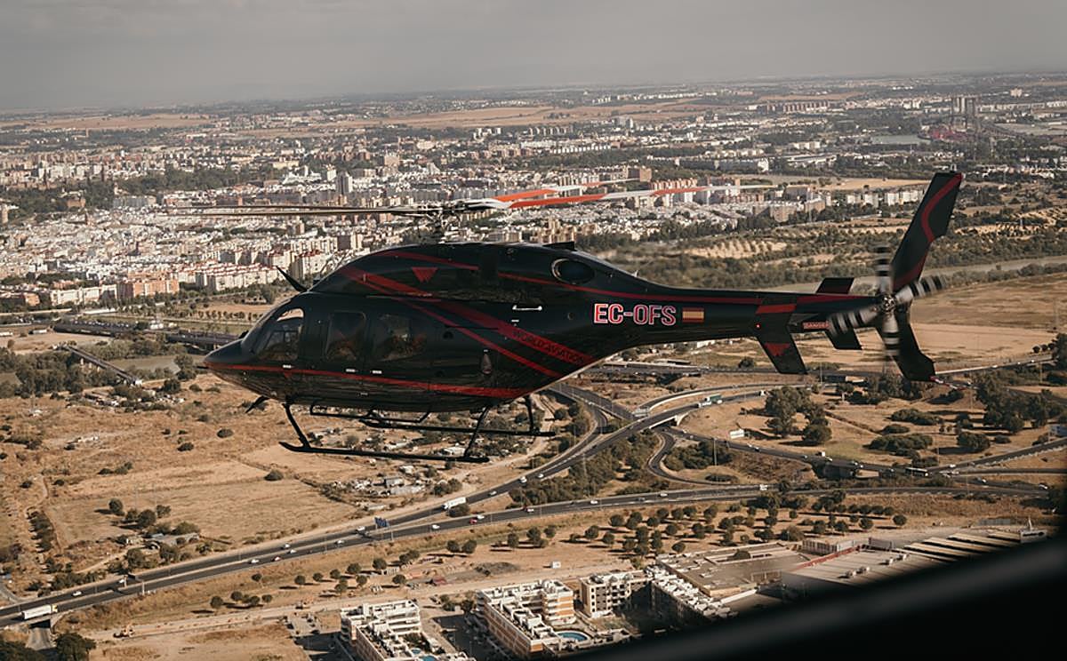 A tourist helicopter flying over Seville.