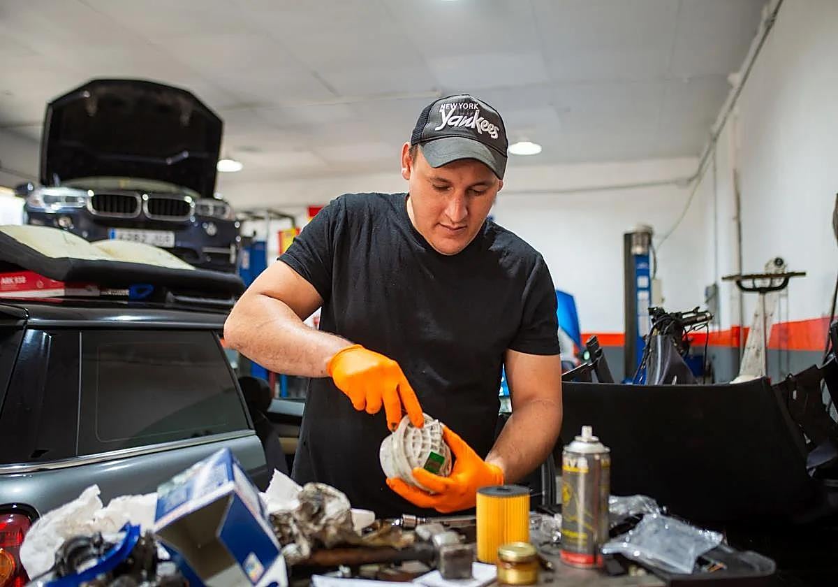 A self-employed businessman, running his independent vehicle repair shop.