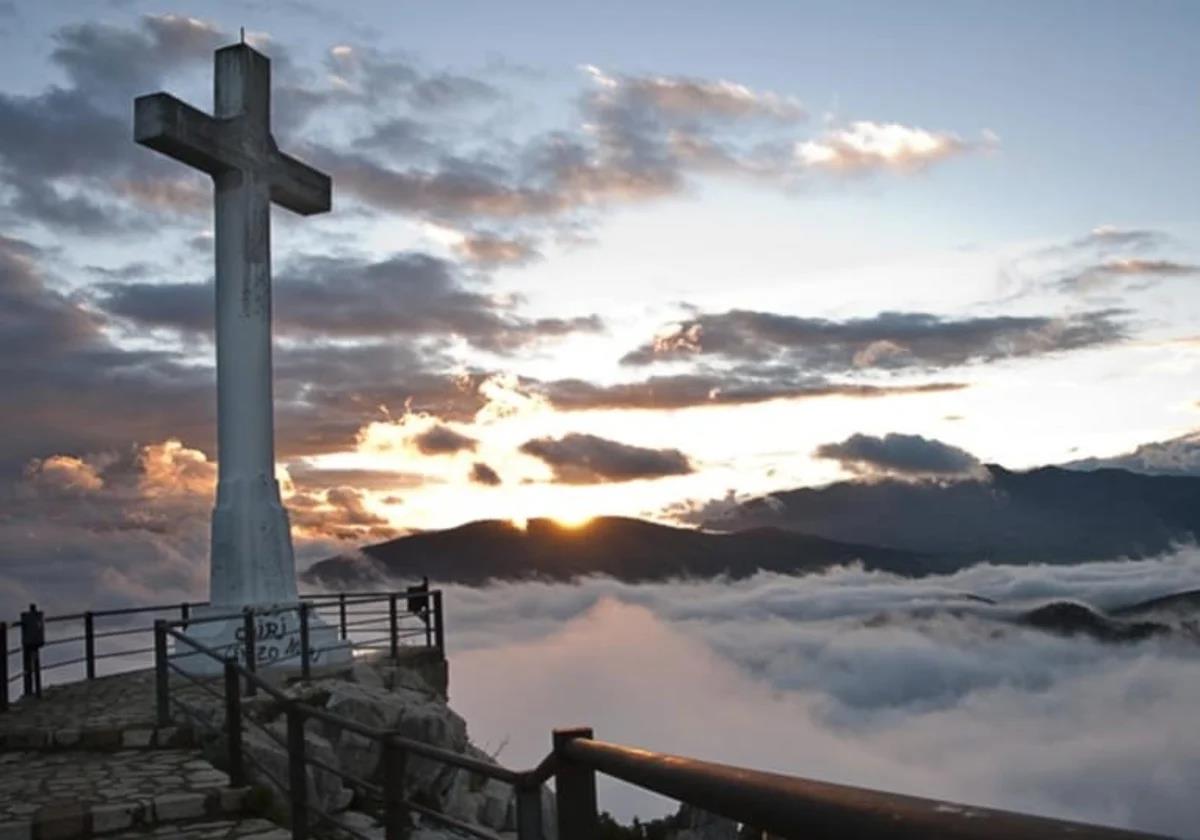 The castle in Spain's Andalucía region with a giant cross soaring above the clouds