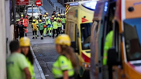 Several people missing and at least 10 injured after slab of building under construction collapses in Madrid