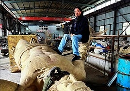 The artist poses with the sculpture of Neptune in a photo taken from his Instagram profile.