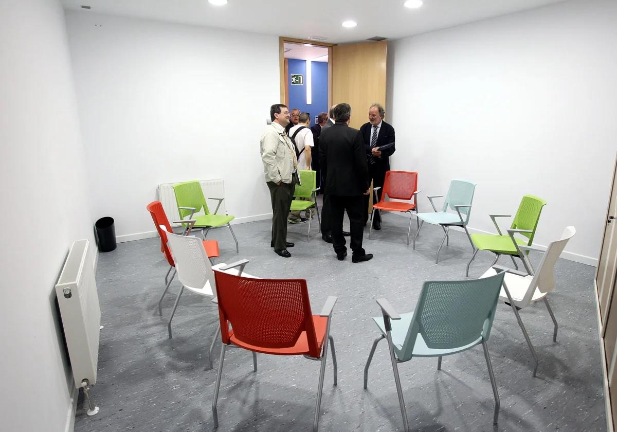 People leave a group therapy session in a mental health centre.