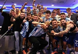 Huijsen, front and centre, in the changing room on Sunday night.