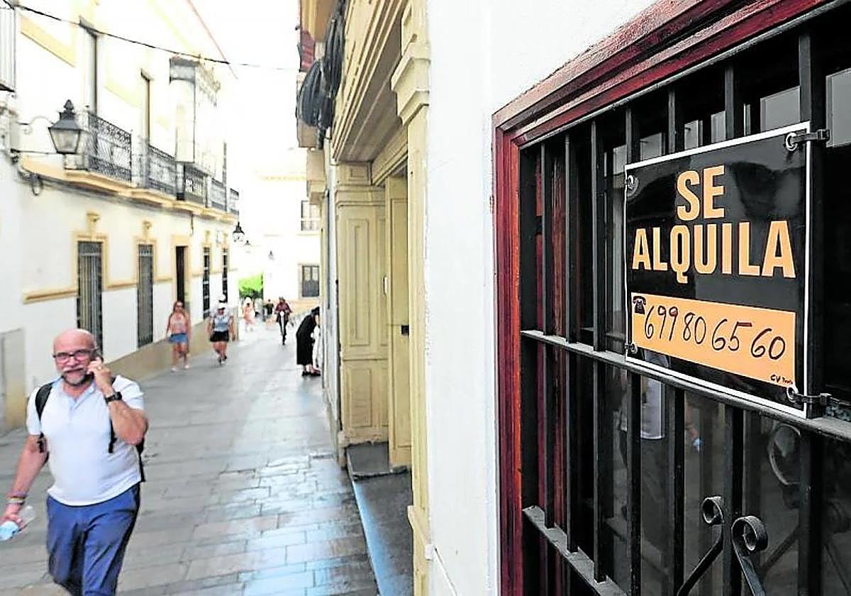 House rental sign in a window.
