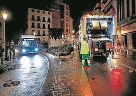 A bin lorry at work in Madrid's Atocha district.