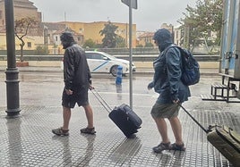 Tourists walking by the Guadalmedina riverbed in Malaga city on Monday.