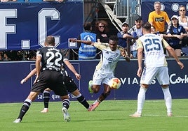 Marbella's Tahiru attempts to progress with the ball.