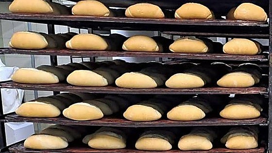 Why is a bread roll called a 'Smurf' in Malaga?