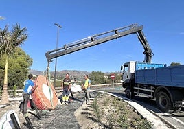 Some of the giant fruit figures on a roundabout in Almuñécar.