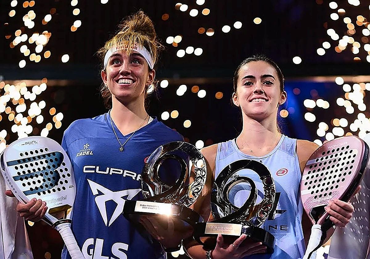 González and her partner Fernández with their trophies.