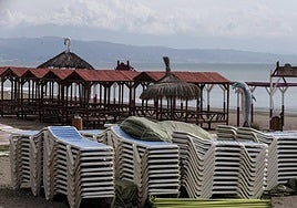 Hammocks piled up on an empty beach in Torremolinos.