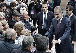 King Felipe VI greets locals on his arrival in L'Hospitalet de Llobregat, where he took part in a celebration marking the city's centenary.