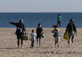 People on the Malvarrosa beach in Valencia.