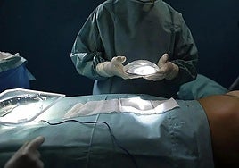Archive image of a surgeon performing a mammoplasty.