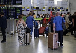 Passengers waiting at Malaga airport.