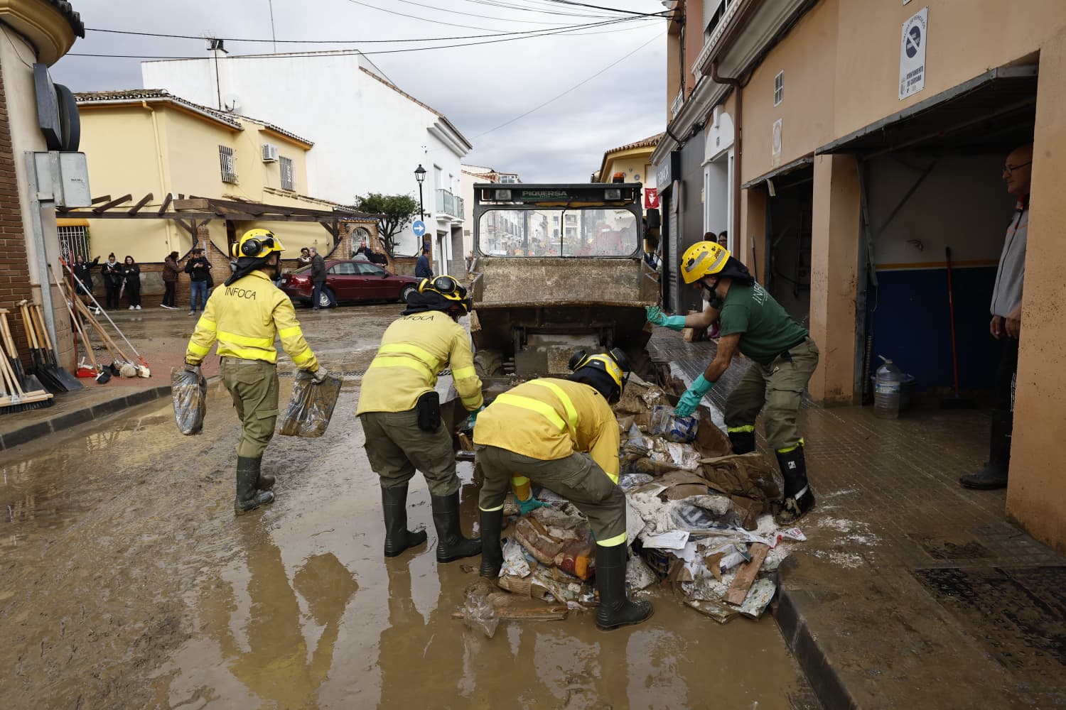 In pictures: Malaga town mops up after a night of torrential rain and the Guadalhorce river at its highest level on record