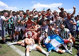 Torremolinos players celebrating their promotion last season.
