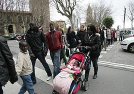 A group of Spanish residents forming a human chain in protest against racism.