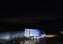 The van left the road and crashed into the riverbed.