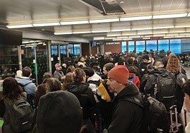 Travellers on the affected Ouigo train wait at Atocha last night.
