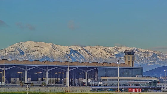 Snow covers mountains behind Malaga's Costa del Sol