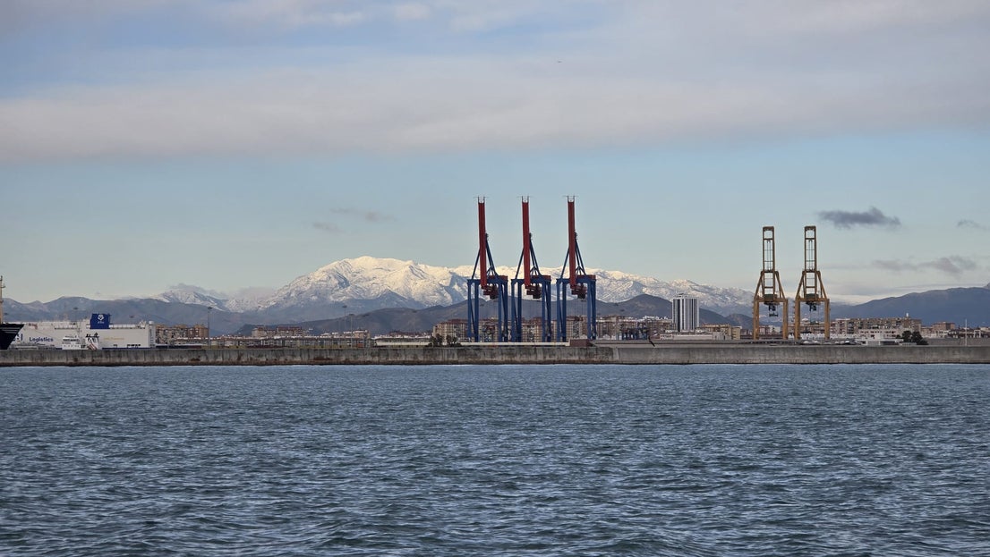 Snow on La Maroma seen from Malaga port.Jabegotes de la Bahía