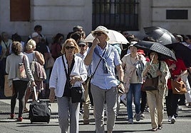 Tourists strolling through the centre of Madrid.
