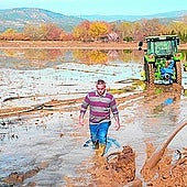 Flooded. Tractors and water pumps to drain farms.