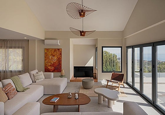Natural light bathes warm materials, creating highly habitable and serene proportions.