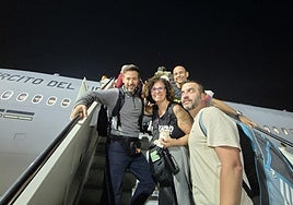 Part of the group of Malaga residents boarding the military plane in Oman.